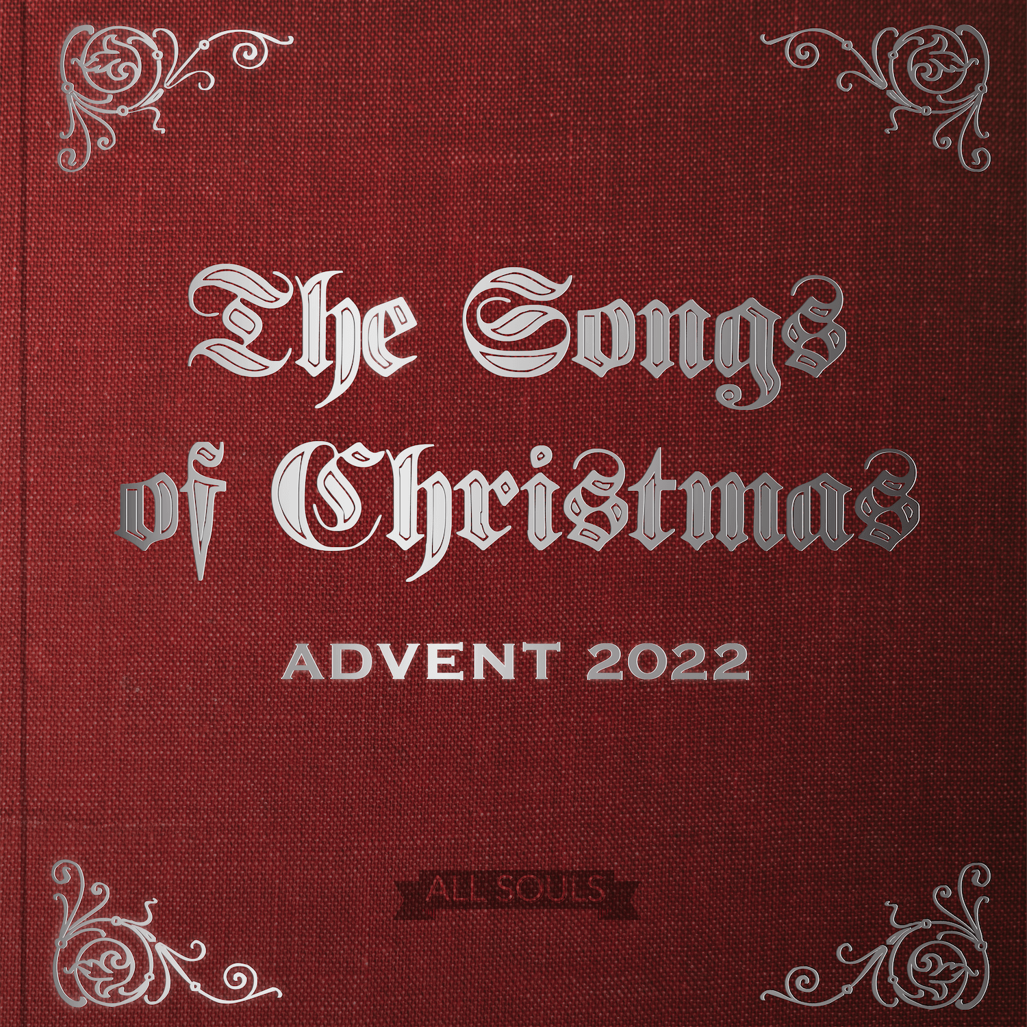 The words The Songs of Christmas in silver on a red book cover
